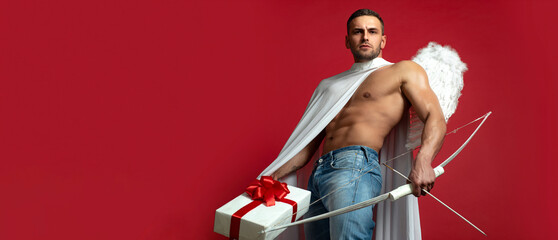 Valentines Day banner. Sexy guy with angels wings. Cupid. Amour. February 14. Arrow of love. Isolated on red. Banner flyer template for advertising for header design.