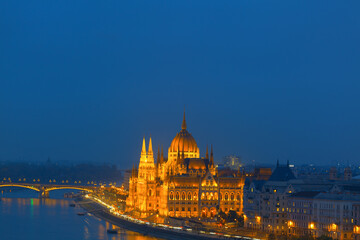 Fototapeta na wymiar Budapest and Danube river in the night . Famous Hungarian Parliament Building illumination