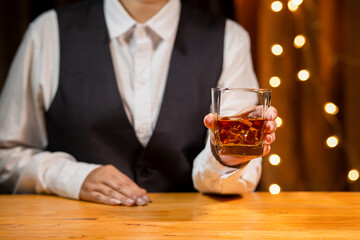 Obraz na płótnie Canvas Bartender Serve Whiskey, on wood bar, 