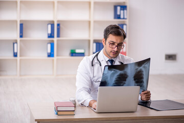 Young male doctor radiologist working in the clinic