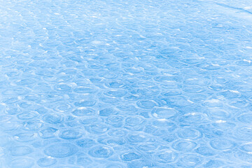 Colored ice. Abstract ice texture. Nature background. Sea ice. patterns on ice