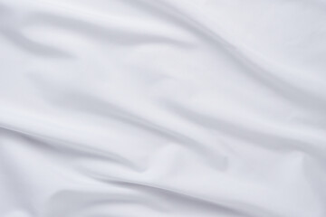 White fabric. luxurious white fabric texture background. Creases of satin, silk and cotton.