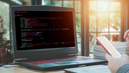 Coders advance the digital world; programmers sit at home doing analysis and coding. The screen of the computer shows statistics.