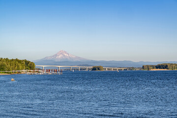 Long transport concrete interstate Glenn L Jackson Memorial Bridge over the Columbia River overlooking Mount Hood