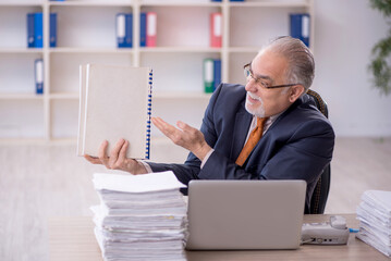 Old male employee and too much work in the office