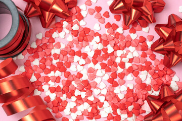 Valentine's hearts with red bows and red curly ribbon. Valentine's Day