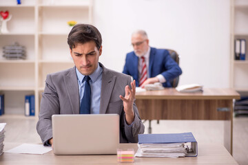 Two male colleagues sitting in the office