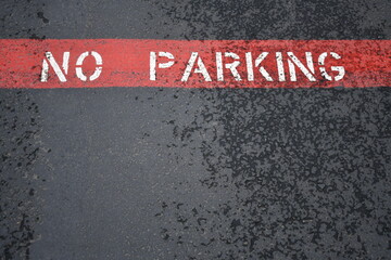 no parking painted on asphalt