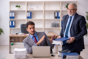 Two male colleagues working in the office