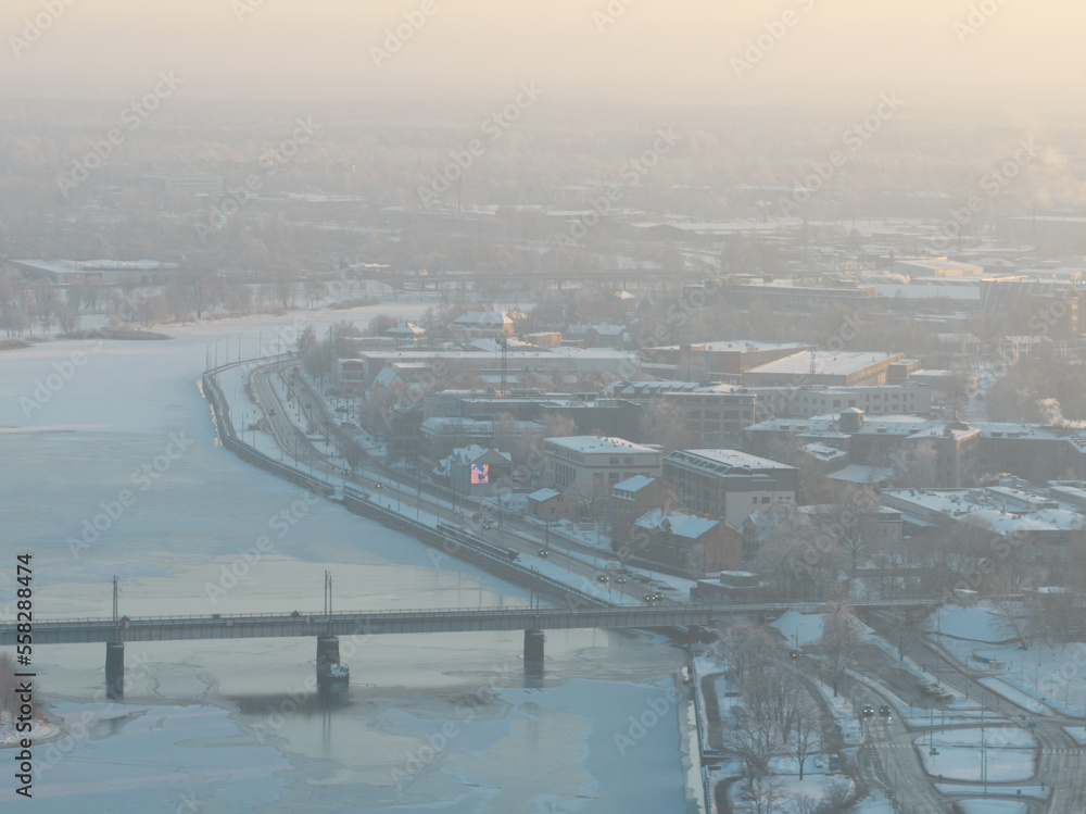 Poster a bridge over a river with a city in the background and a bridge over the water with a bridge in the