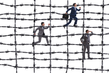 Businessman in barbed wire concept