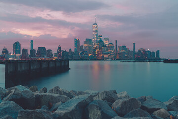 Fototapeta na wymiar city skyline at sunset views Manhattan pier beautiful sunrise