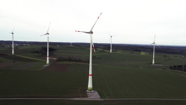 Aerial Shot of Rotating Windmills on a Field in Sauerland, Germany