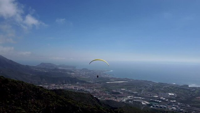 Paragliding Parachute Flying Over Tenerife Shoreline, Canary Islands, Spain. Aerial Shot