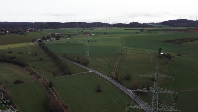 Critical Infrastructure: Aerial View of Powerlines Connecting Windmills to the German Power Grid in Sauerland, Germany