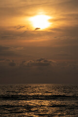 sunset on the shore of the beach