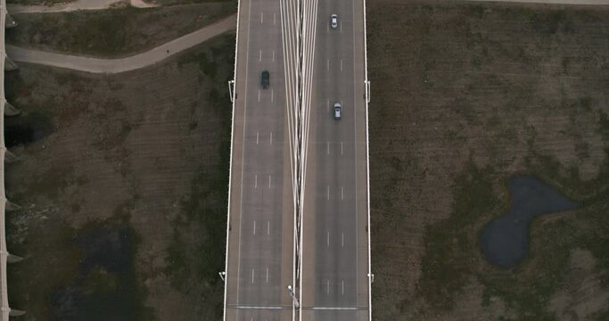 Birds eye view of cars going over the The Margaret Hunt Hill Bridge in Dallas