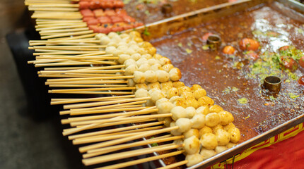 Thai street food in temple fair, and night local markets in Bangkok. Asian Retail shops. Travel in Thailand.