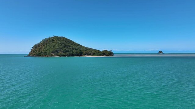 Fast flight over luscious tropical waters towards Double Island Cairns