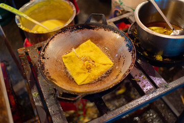 Thai street food in temple fair, and night local markets in Bangkok. Asian Retail shops. Travel in Thailand.
