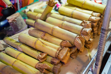 Thai street food in temple fair, and night local markets in Bangkok. Asian Retail shops. Travel in Thailand.