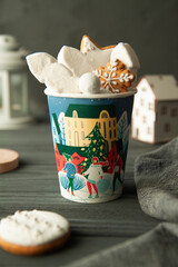 Paper cup with marshmallows and New Year's Christmas cookies