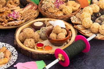 Harvest Festival Is Celebrated As Makar Sankranti, Lohri, Uttarayan, Maghi, Poush Sankranthi, Magh Bihu With Sesame Sweet viz. Tilgul, Til Mithai, Gajak, Chikki, Tilkut, Patang, Firki And Peanuts - obrazy, fototapety, plakaty