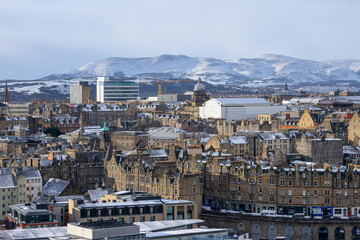 Calton Hill , Cityscape view of Edinburgh old town numerous monuments and buildings around during winter snow at Edinburgh , Scotland : 28 February 2018