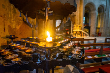 Durham Cathedral Inside and candles , Unesco Historic Gothic and Romanesque church during winter snow morning in Durham , United Kingdom : 1 March 2018