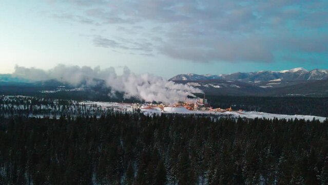 Aerial View of Pulp Mill in Cranbrook, British Columbia: Industrial Facility and Machinery Processing Raw Materials for Paper Production in the Cold Winter Weather