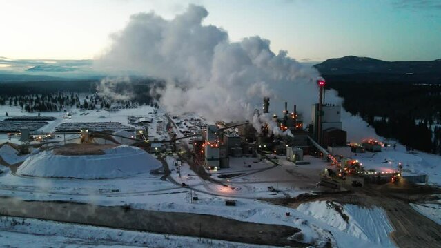 Winter Morning at Pulp Mill in Cranbrook, British Columbia: Aerial View of Industrial Facility and Specialized Machinery Transforming Timber into Wood Pulp