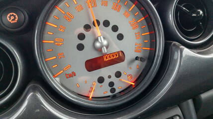 kilometers car 100001 kilometers miles odometer of Modern car close up speedometer dashboard