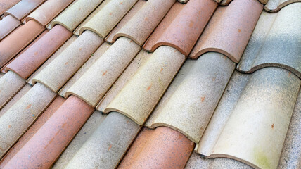 new roof tiles ceramic shingles on house building as background