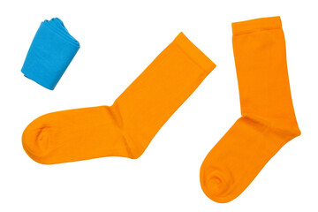 A pair of yellow cotton socks, as if tossing up a roll of blue socks, on a white background