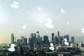 Double exposure of social network icons hologram on Los Angeles office buildings background. Networking concept