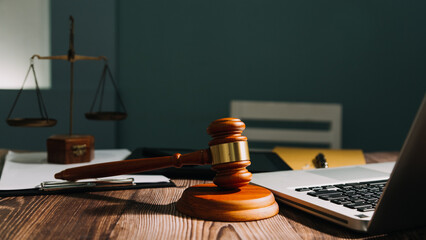 Business and lawyers discussing contract papers with brass scale on desk in office. Law, legal...