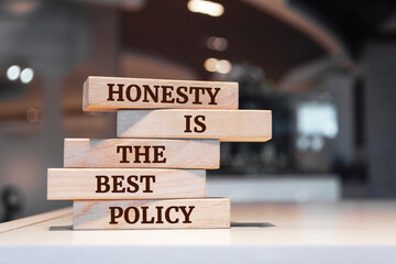 Wooden blocks with words 'Honesty Is The Best Policy'.