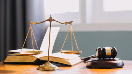 Business and lawyers discussing contract papers with brass scale on desk in office. Law, legal...