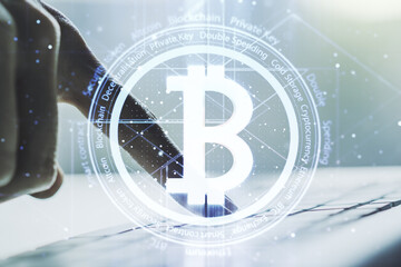 Naklejka premium Creative Bitcoin concept with hands typing on computer keyboard on background. Double exposure