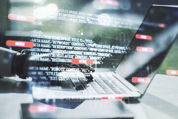 Abstract creative coding concept with hands typing on laptop on background. Multiexposure