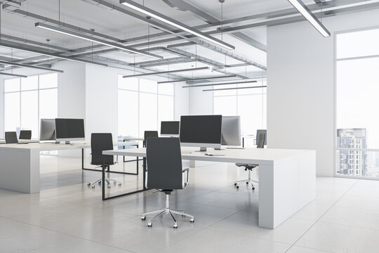 Perspective View On Monochrome Style Open Space Office With Modern Computers On Light Tables, Loft Ceiling And City View Background From Panoramic Windows. 3D Rendering