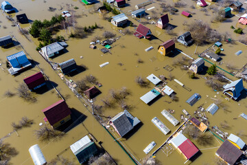 Aerial view of the flooded suburban areas during the spring flood. Houses in the water during the...