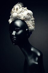 Head of mannequin in creative headwear with sea shells