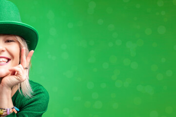St. Patrick's Day. Beautiful smiling woman wearing green hat