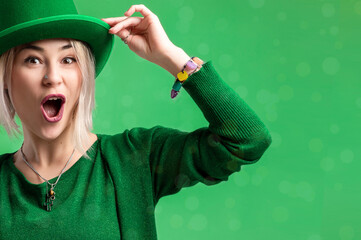 St. Patrick's Day. Beautiful smiling woman wearing green hat.