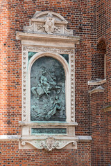 Close-up bas relief on a St. Mary's Basilica on the Krakow Main Square, Rynek Glowny.