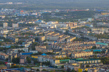 Morning cityscape. Top view of the buildings and streets of the city. Residential urban areas at sunrise. Beautiful aerial city landscape. Petropavlovsk-Kamchatsky, Kamchatka Krai, Far East of Russia.