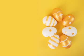 easter egg hunt, golden white easter eggs on a yellow background