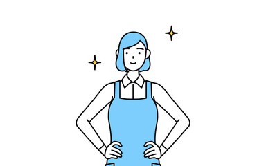 両手を腰に当てたエプロンを着た女性