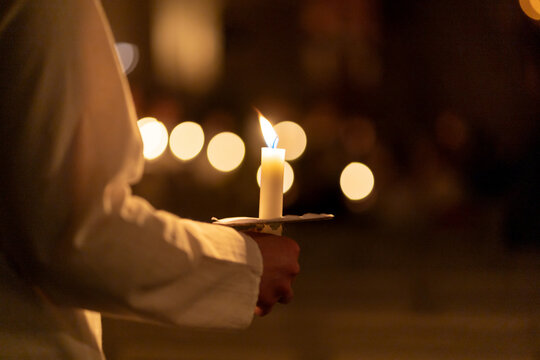 People handling candles in the hands. Christmas and lucia holidays